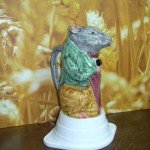 Broc barbotine Rat ou souris au parapluie. Origine Poët Laval. différentes couleurs .hauteur 20 cms . Origine Poët Laval