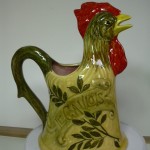 Coq Le Gaulois. Origine Nord. Fond ocre . h 21.5 x L13.5
